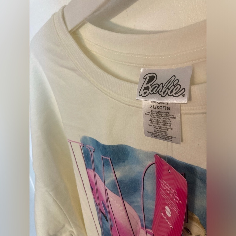White Barbie sweatshirt in size XL. Has picture of Barbie on a flamingo.1 left - Picture 2 of 4